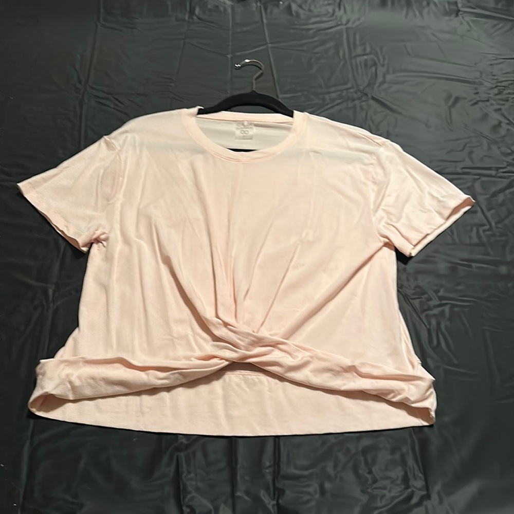 Light blush color that twists at the waist